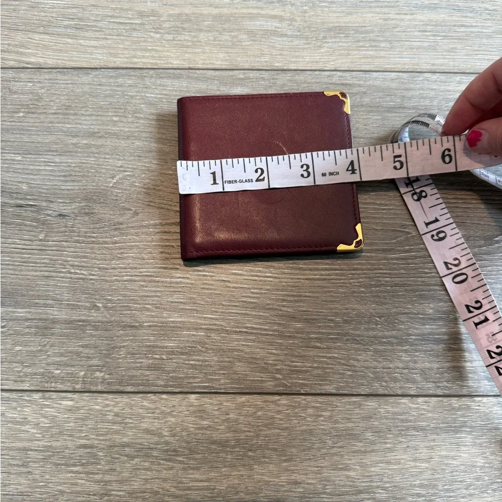 Cartier Men’s Deep Red Leather Bifold with Gold Corners